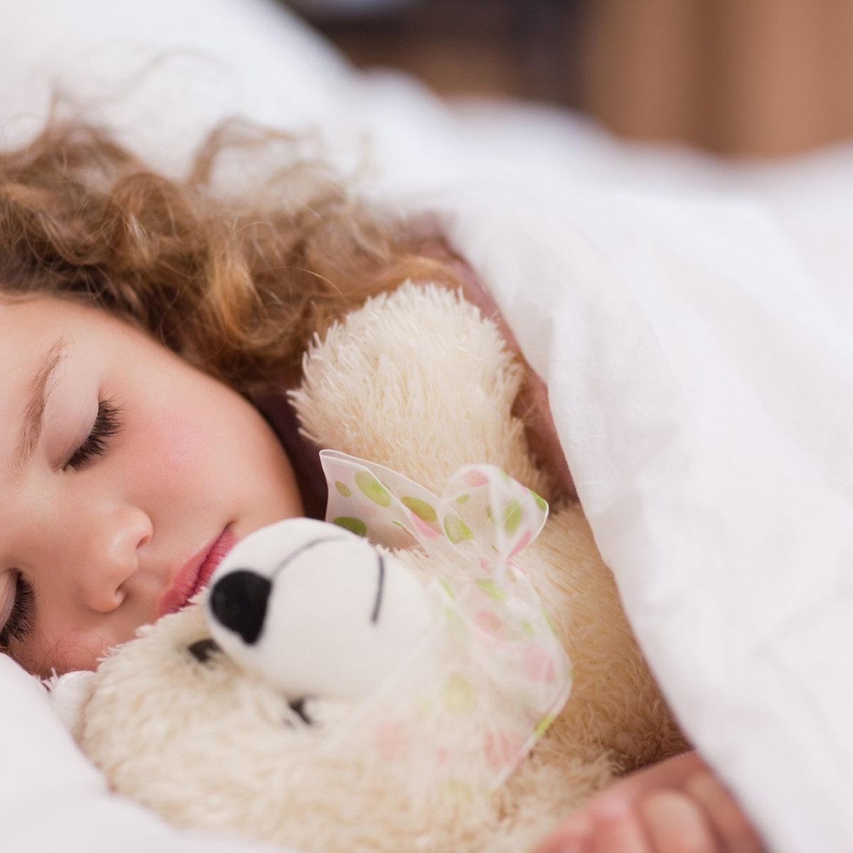 Little girl sleeping with her daddy