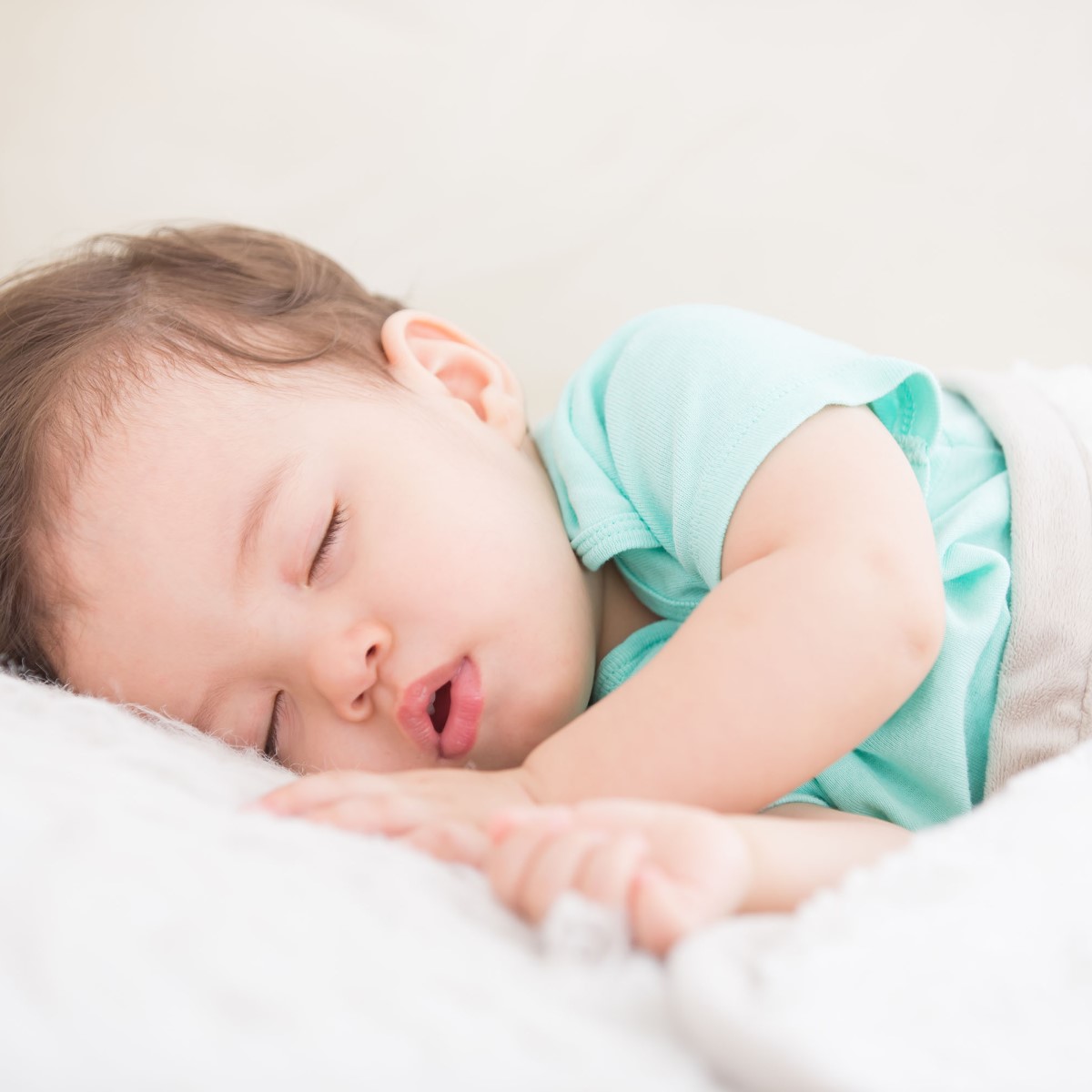 Newborn cute baby sleeping. Closeup portrait, caucasian child